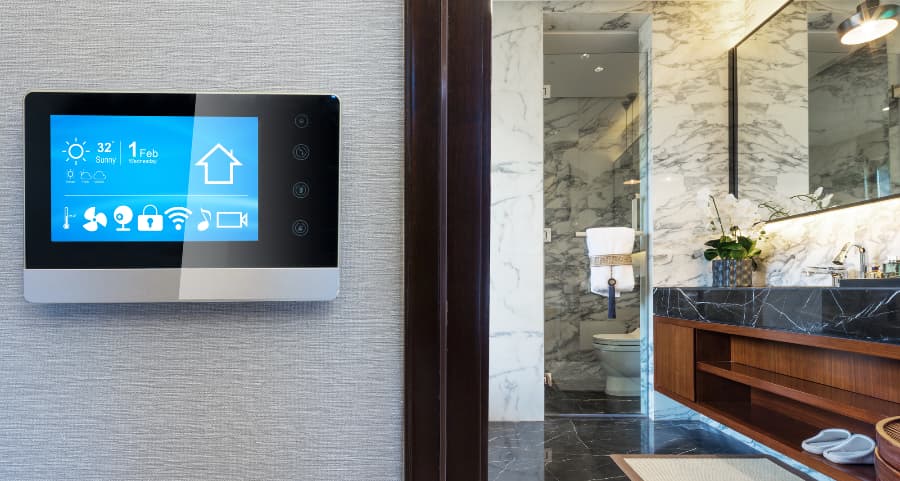 Smart home control panel on wall outside bathroom
